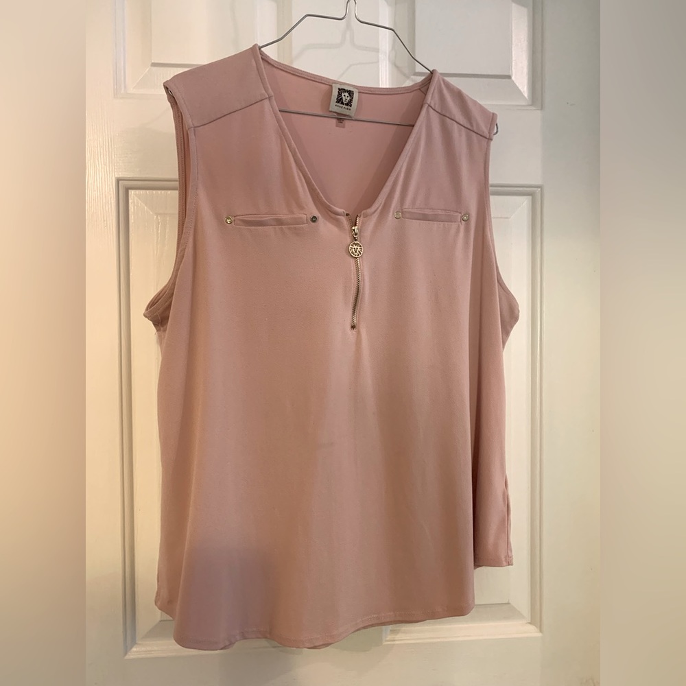 Pink sleeveless non wrinkle, fabric lightly worn